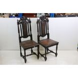 Pair of Victorian Heavily Carved Oak Side Chairs in the 17th century manner, the top rail carved