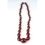 An Art Deco Cherry Amber beaded necklace.