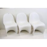 In the manner Verner Panton, Three White Plastic Cantilever Panton style Chairs, 49cm wide x 83cm