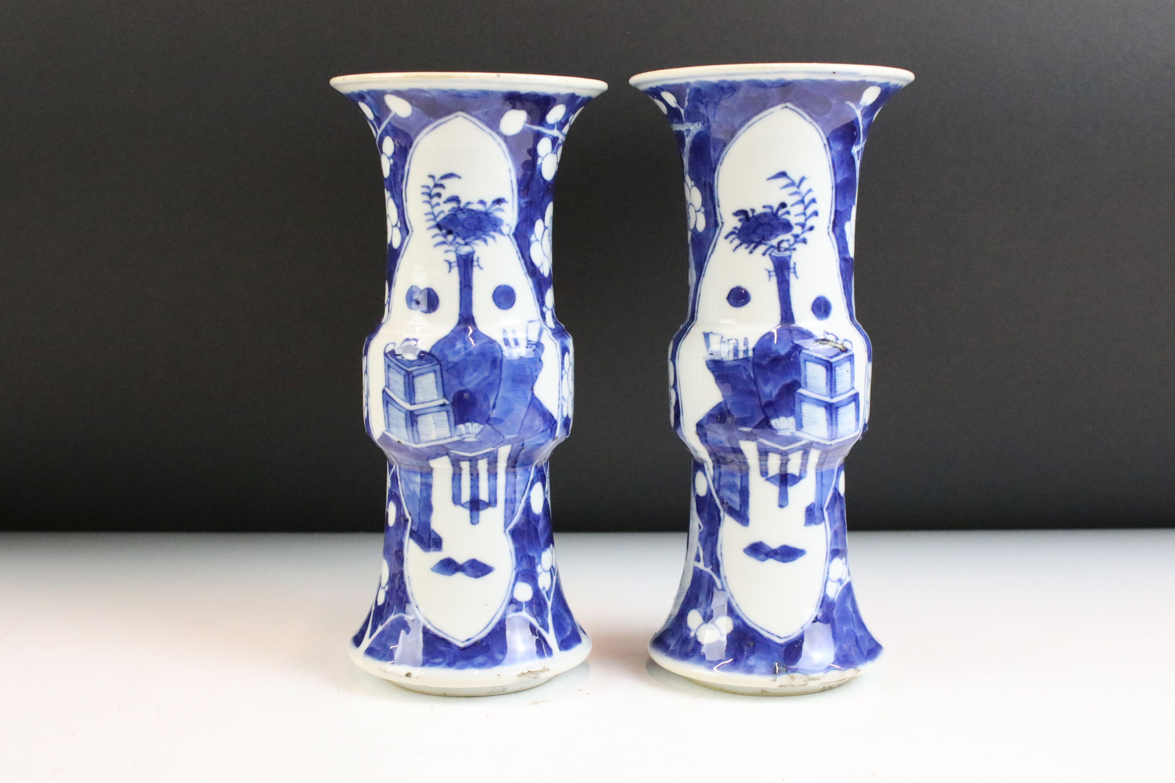 Pair of Chinese blue and white Gu vases being hand painted in the prunus pattern with panelled