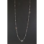 A silver CZ and fresh water pearl designer style necklace.