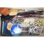 A box of mixed collectables include powder compact, penknife, fountain pens, thimbles, military