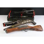 A small collection of reproduction non firing flintlock pistols and knives.