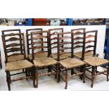 Set of Eight Oak Ladder Back / Ladderback Dining Chairs with rush seats, each 99cm high x 48cm wide