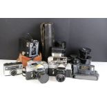 Assorted vintage cameras and lenses to include a Pentacon 4/200 lens, Vivitar wide angle No.