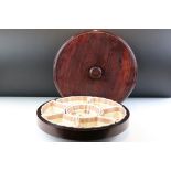 20th Century Chinese lazy susan with ceramic serving dishes fitted within a rotating wooden case,
