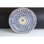 19th century pottery plate, painted in blue with stylised flowers, 30cm diameter