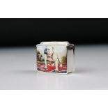 A silver and enamel pill box with British bulldog image.