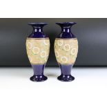 Pair of Doulton Lambeth Slaters Patent baluster vases, florally painted with gilt highlights against