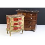 A wooden apprentice style chest of two small and three large drawers together with a painted