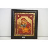 An ebonised framed Russian icon portrait of the Madonna and infant, 35 x 30.5cm