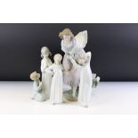 Group of Lladro ceramic figurines to include a large female figure, two single child figurines and a