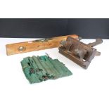 A small collection of carpenters tools to include a spirit level, wood plane and a quantity of