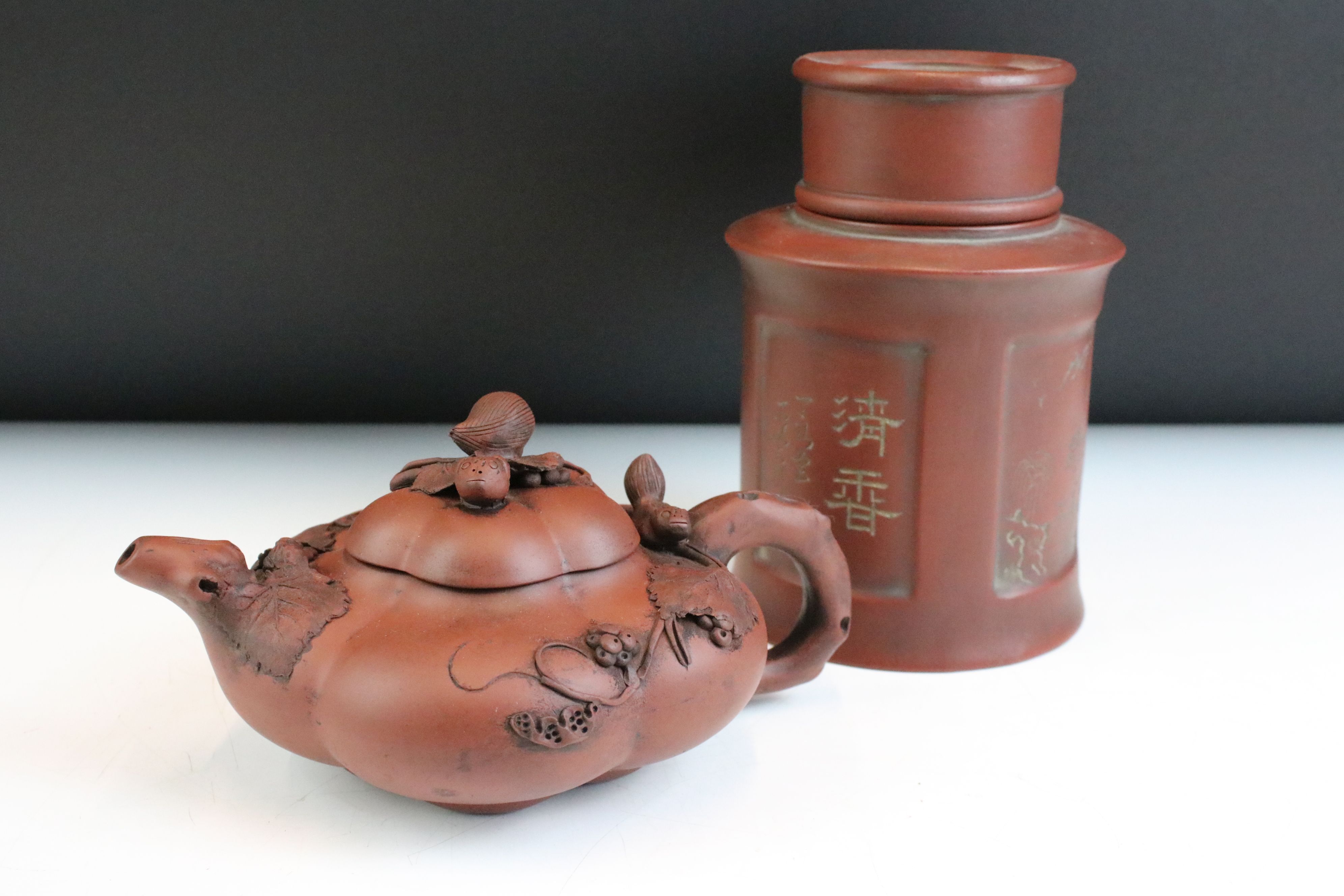 20th Century Chinese Yixing red clay tea pot of gourd form having applied animal and vine leaf