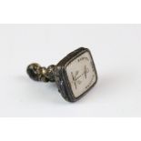 An antique watch fob seal, the seal reads 'Anchor Fast Anchor'.