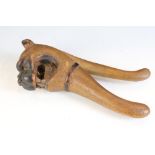 19th century carved treen nutcracker in the form of a dog baring its teeth, approx 21cm long