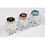 A set of three Norwegian 925 Sterling silver and enamel pepper shakers with gilt decoration.