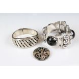 A brutalist style sterling silver bracelet set with three cabochon's together with a bangle and