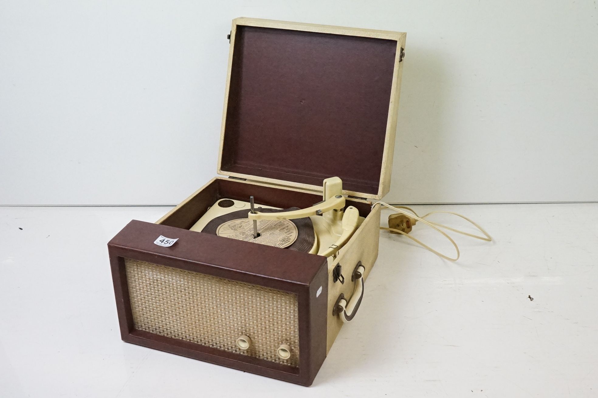Collaro high fidelity portable record player set within a red and white faux leather case.