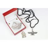 A collection of three Zoroastrian white metal symbol pendants.