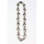 A Georg Jensen Denmark leaf and berry necklace, fully marked to the clasp.