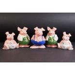 Five 20th Century Wade Nat West pigs advertising piggy banks. To include school boy, two school girl