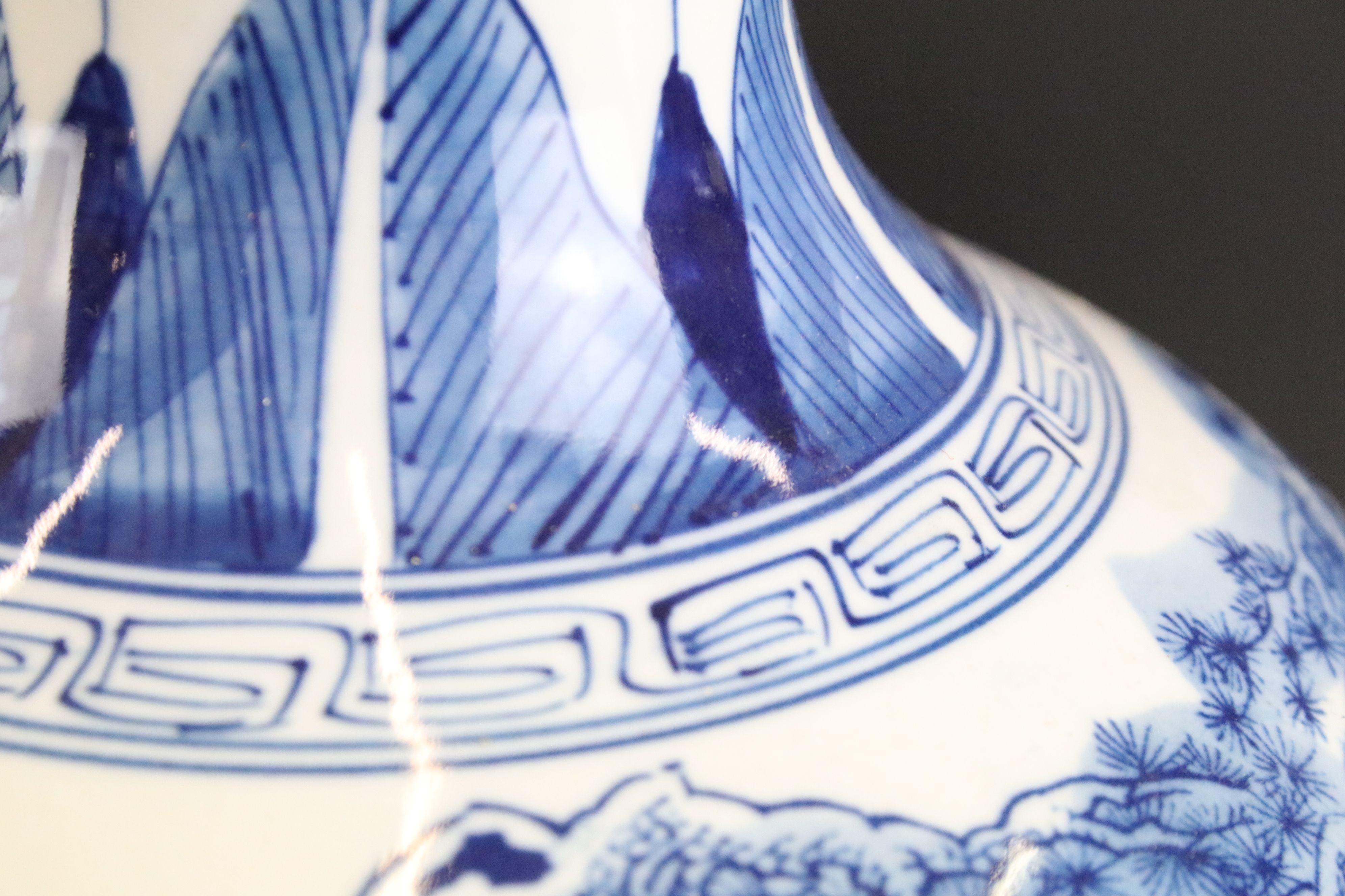 Near pair of Chinese blue and white bottle vases having printed and hand painted landscape scenes to - Image 4 of 6