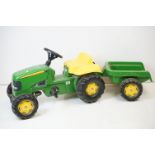 Rolly Toys 'John Deere' child's ride-on pedal powered tractor with trailer, in green and yellow