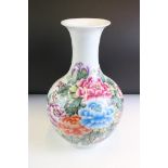 Chinese baluster vase having printed peony florals to the sides. Red seal mark to the base. Measures