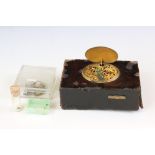 An antique anatomical music box with pop up singing bird (A/F) together with spare parts.