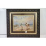 A carved oak framed oil painting coastal scene of figures on horseback on a beach with fishing