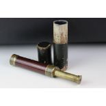 An early 20th century brass cased telescope with original card case (A/F).