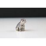 A well cast silver dog figure.