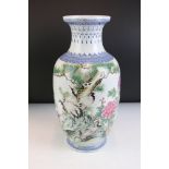 20th Century Chinese vase featuring peonies and cranes perched on a pine tree with blue painted
