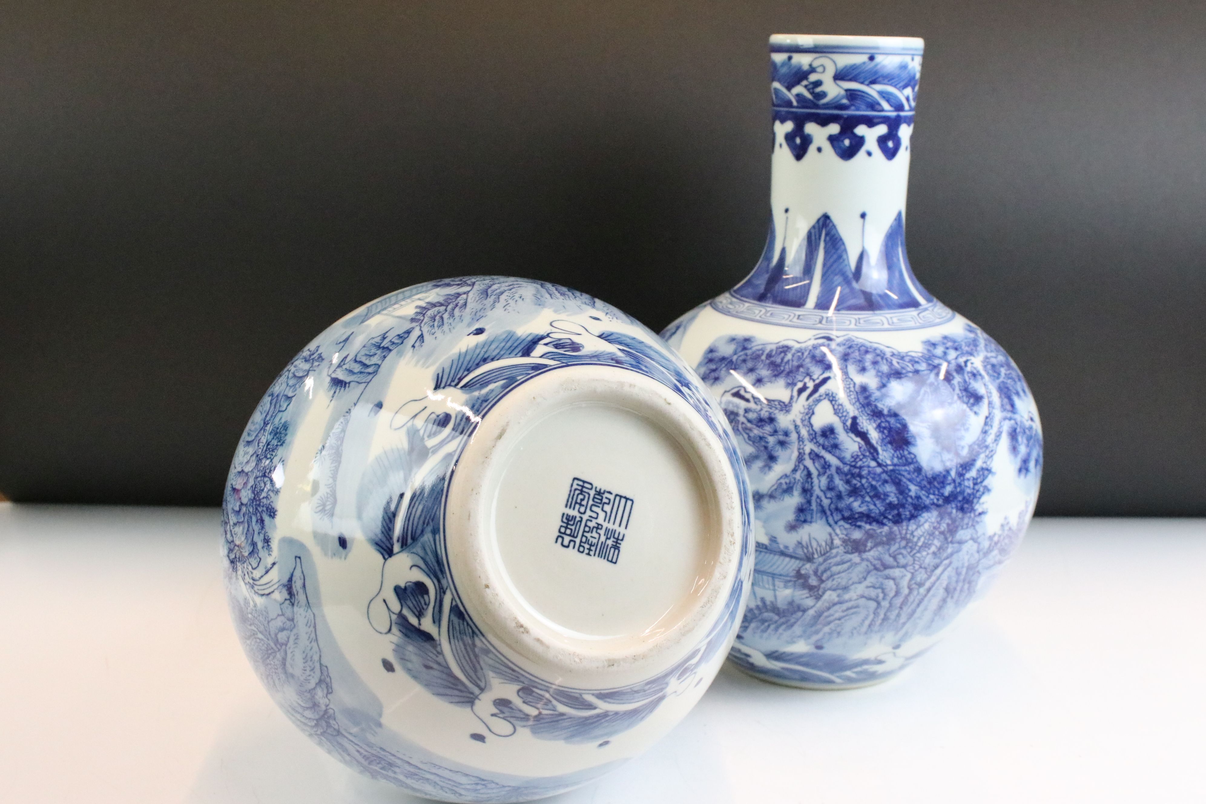 Near pair of Chinese blue and white bottle vases having printed and hand painted landscape scenes to - Image 5 of 6