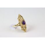 A gold plated on silver dress ring the central amethyst surrounded by diamonds.
