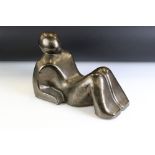 Ceramic modernist sculpture in the form of a stylised recumbent figure. Unsigned. Measures 34cm