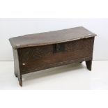 17th century Oak Six Plank Coffer with carved panel to front, iron fittings and raised on stile