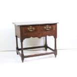 18th century Mahogany Side Table with moulded top, two drawers, shaped apron and raised on turned