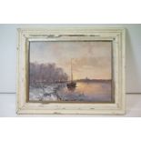 A framed oil painting of an extensive river scene with moored sailboats at dusk, 26.5 x 36.5cm