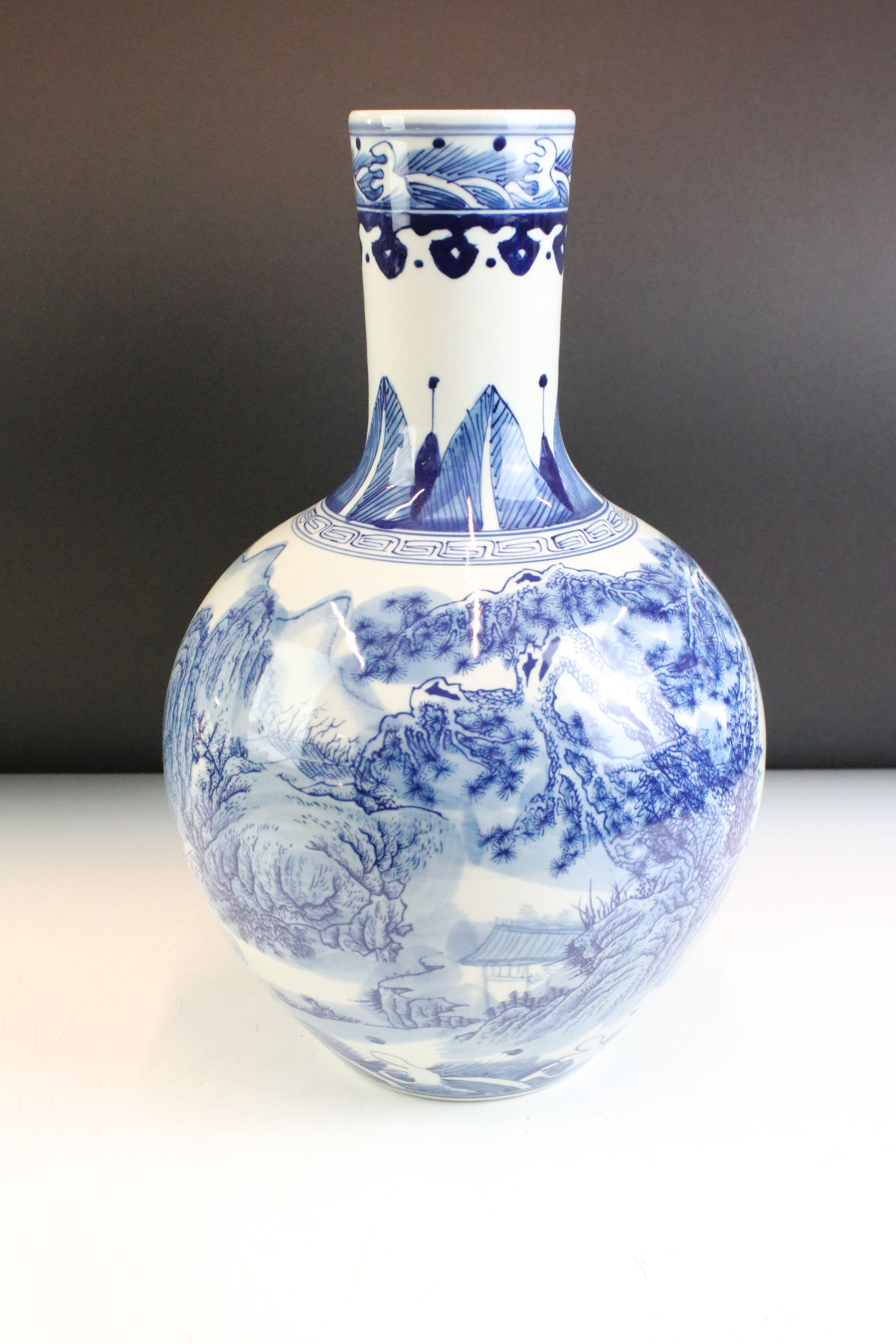 Near pair of Chinese blue and white bottle vases having printed and hand painted landscape scenes to - Image 2 of 6