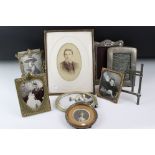 A small collection of vintage photograph frames to include brass and silver examples.