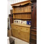 19th century Pine Dresser with a two shelf plate rack to back above two drawers and two cupboard