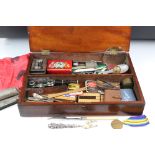 A group of mixed collectables contained within a wooden box to include opera glasses, money box,