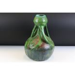 Art Nouveau antique ceramic vase of waisted form with four scrolling handles and green glaze