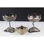 A pair of white metal Middle Eastern cups together with a similar trinket dish.