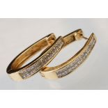Pair of diamond 14ct yellow gold elongated hoop earrings, two rows of a total of thirty-two square