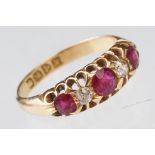 Early 20th century ruby and diamond 18ct yellow gold ring, three graduated round mixed cut rubies,
