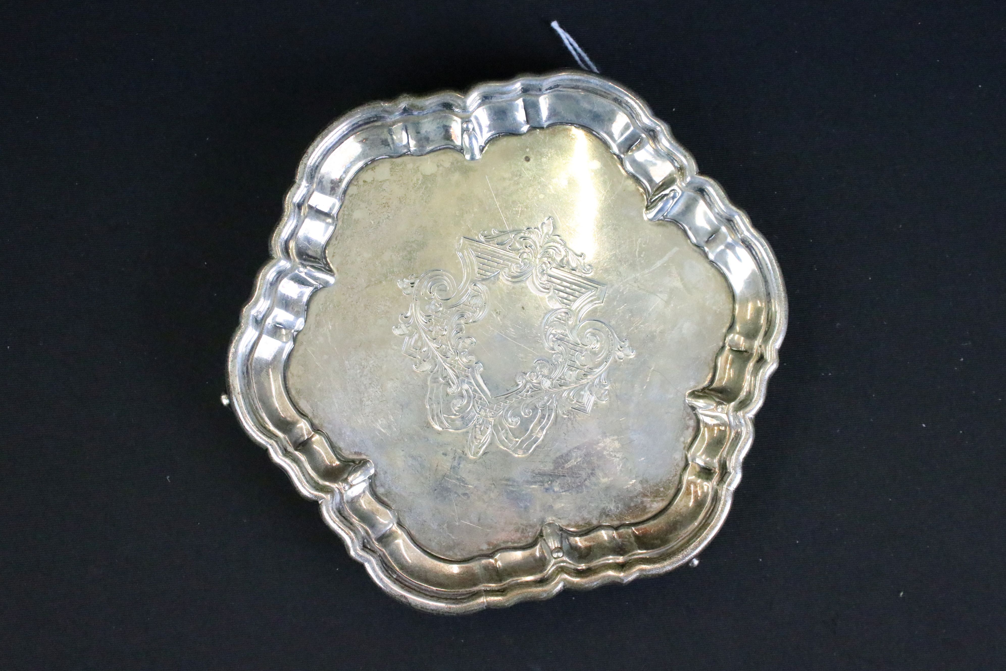 William Hutton & Sons silver salver having a moulded rim with engraved crest raised on scrolled - Image 2 of 5