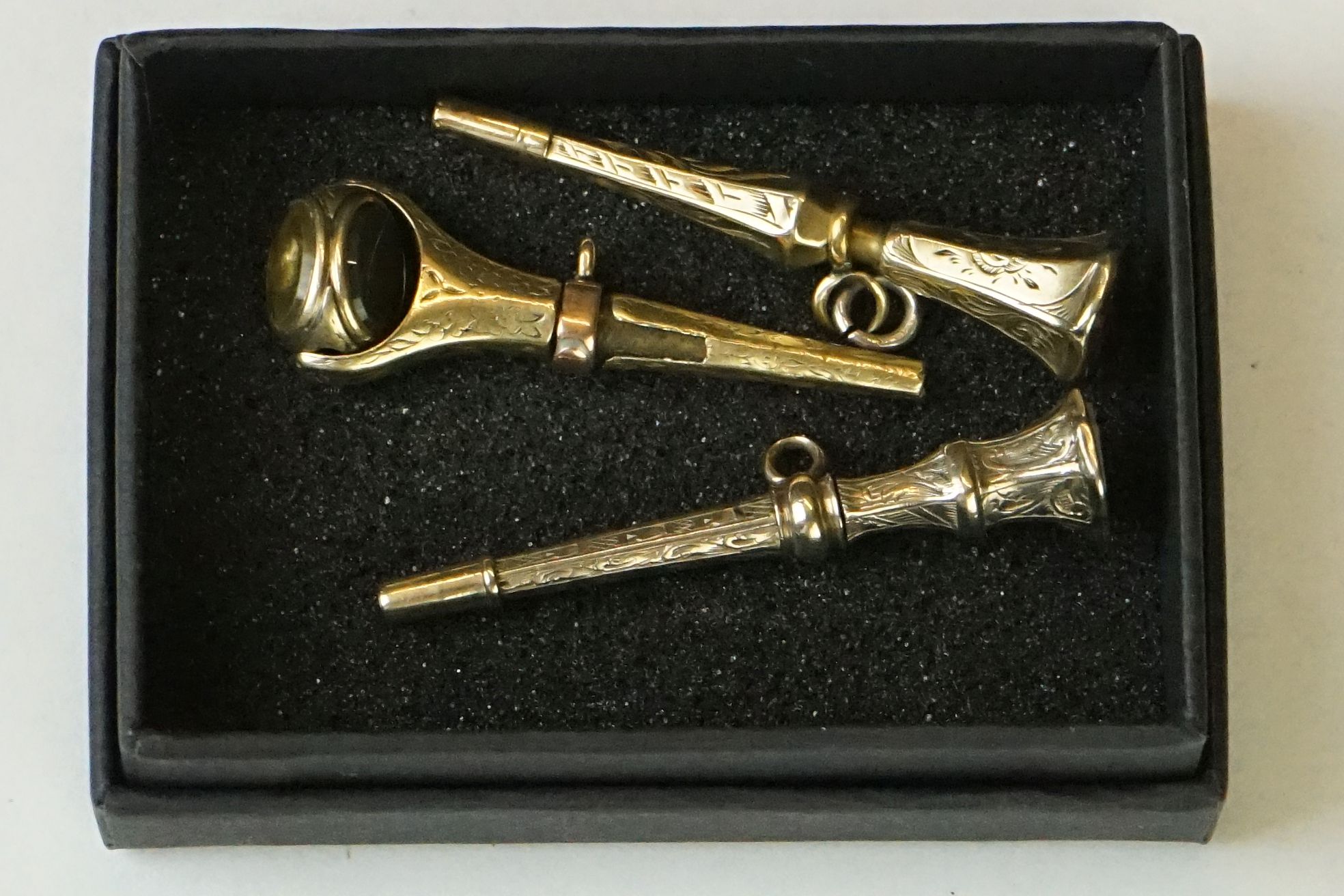 Three 19th Century gold plated pocket watch keys / winders, one having a swivel to top set with - Image 2 of 5